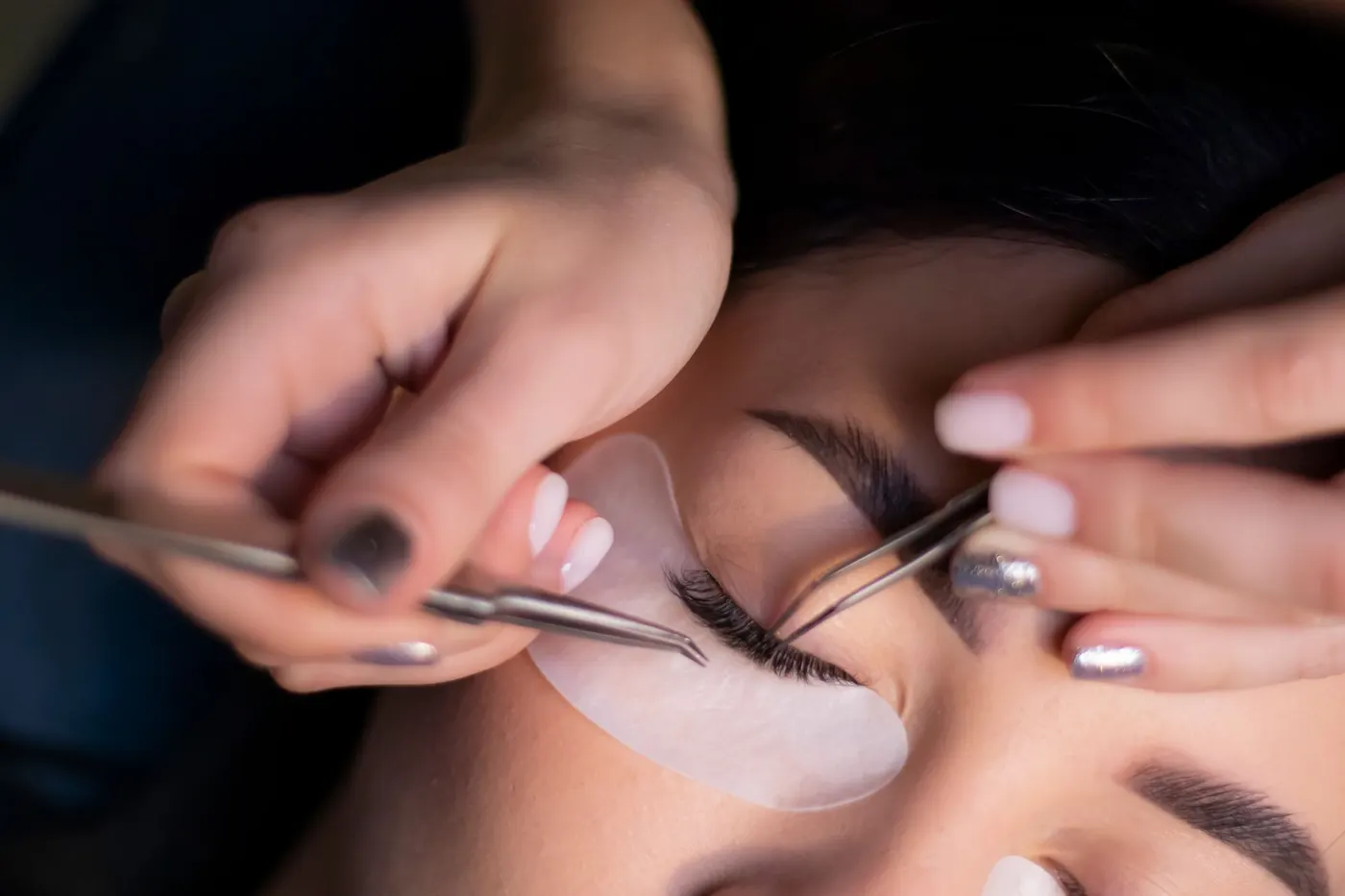 Lashes being laid onto the silicone shield during a lash lift